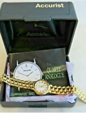 VINTAGE ACCURIST GOLD TONE SLEEK QUARTZ WATCH WHITE DIAL